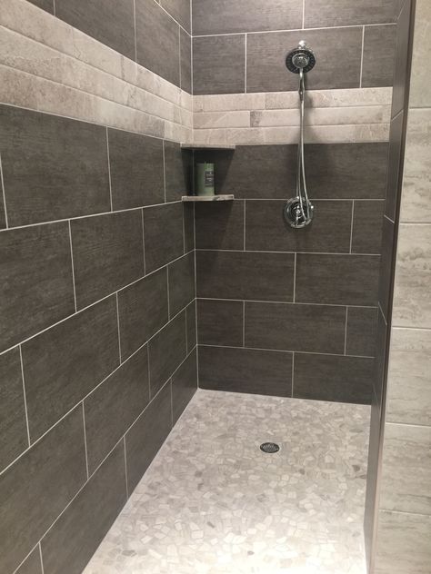 Love this shower style. Color tile is a little dark Dark Color Tiles For Bathroom, Large Dark Tile Shower Ideas, Dark Stone Shower Tile, Dark Tile Shower Floor, Charcoal Shower Tile, Dark Shower Light Floor, Dark Gray Shower Tile, Dark Grey Shower Tile, Grey Tile Shower