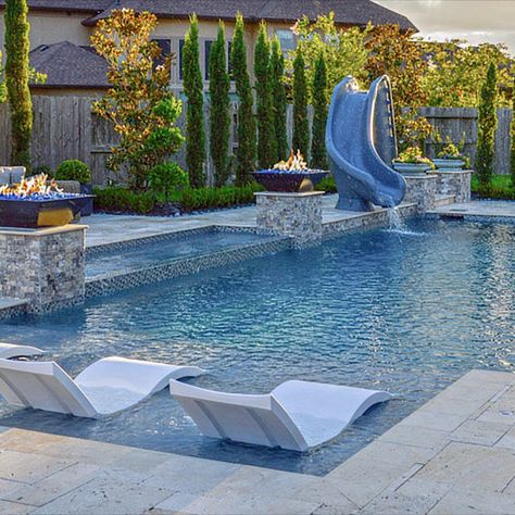 Pebble surfaces are all the rage when it comes to interior pool surfaces of custom-built swimming pools. If you are looking to have an oasis in your backyard or update your current oasis, and you are looking for low maintenance, using pebble finishing on your pool’s surface is a great option.  Here is an example of Pebble Tec in French Gray Pebble Finish Pool, French Grey Pebble Sheen Pool, Pebblecrete Pool Colours, Grey Stone House, Interior Pool, Rock Walkway, Pebble Tec Pool, Stone Backyard, Pool Gazebo