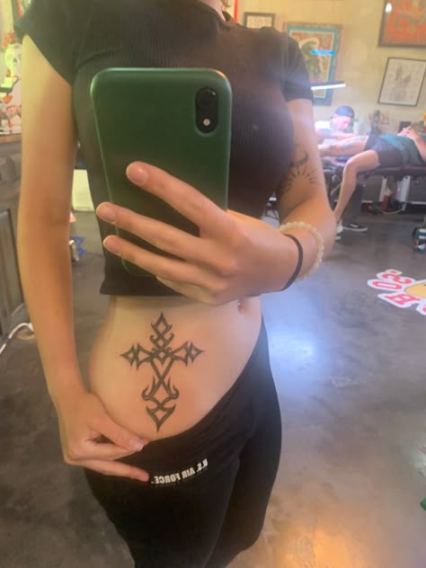 Spine Tattoos Y2k, Opiumcore Tattoo, Ecco2k Tattoo, Grunge Chest Tattoo Female, Alt Stomach Tattoos, Cross Tattoo Aesthetic, Cross Stomach Tattoo, Emo Y2k Tattoos, Spine Tattoos Goth