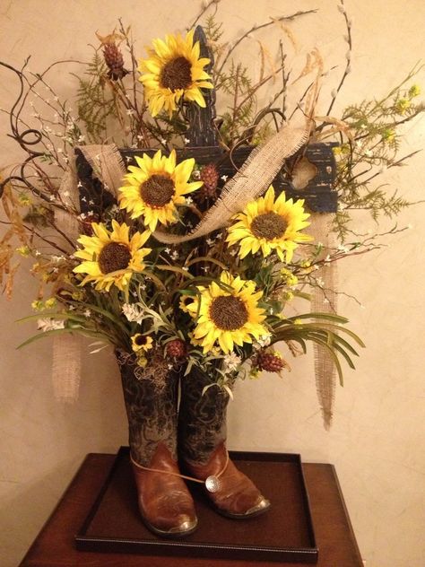 Not a huge fan of the colors, but an arrangement out of boots is a cute idea Summer Table Decorations, Spring Floral Arrangements, Fall Flower Arrangements, Silk Floral Arrangements, Fall Arrangements, Cottage Gardens, Sunflower Decor, Silk Flower Arrangements, Deco Floral