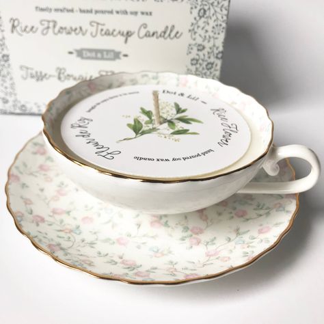 Each teacup candle includes a cup, saucer, candle, beautifully printed dust cover and a pretty gift box. The scalloped edges of the fine bone china cups and saucers are delicately detailed with gold. The soy wax washes out easily with soap and hot water afterwards, leaving you with a lovely keepsake cup and saucer set. Our finely hand-poured candles are made with a blend of 100% pure soy wax & botanical oils, with a cotton wick, and burn for 20-25 hours. Rice Flower: Sweet, fresh, and soft with Flower Teacup, Cup Candles, Teacup Candle, Rice Flower, Teacup Candles, Gourmet Gift Baskets, Soy Candle Making, China Cups And Saucers, Candle Inspiration