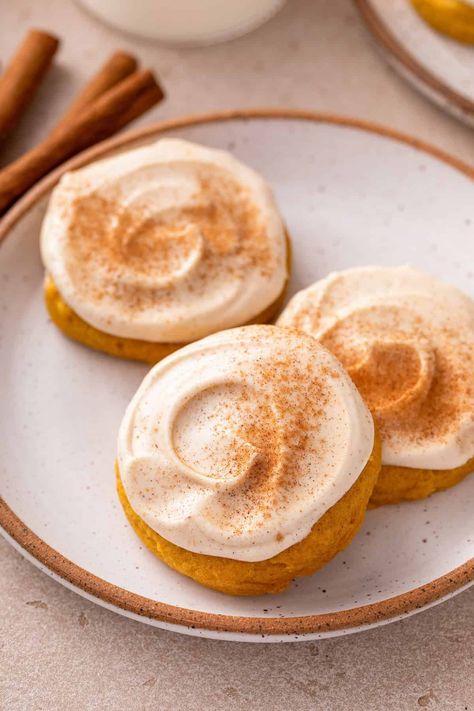 These pumpkin cookies with cream cheese frosting are so irresistibly soft and pillowy, everyone will be begging for more! Loaded with warm Fall spices, these soft pumpkin cookies are topped with a cinnamon cream cheese frosting that pairs perfectly. Bonus: They’re quick and easy to make, with no dough chilling needed! Soft Pumpkin Cookies With Cream Cheese Frosting, Pumpkin Cream Cheese Frosting, Pumpkin Cream Cheese Cookies, Pumpkin Cookies With Cream Cheese, Frosted Pumpkin Cookies, Turkey Desserts, Sweet Pumpkin Seeds, Cookies With Cream Cheese Frosting, Cream Cheese Frosting Easy