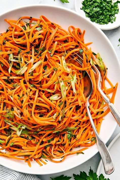 This easy and healthy French carrot salad recipe is the most exquisite combination of crunchy julienned carrots, green onion, and fresh herbs, tossed in a bright honey mustard dressing. It's the perfect vegetable side dish for spring and summer! Carrot Salad Dressing, Downshiftology Recipes, Healthy Mediterranean Recipes, Grated Carrot Salad, Carrot Salad Recipes, Eating Carrots, Julienned Carrots, Super Salads, Mediterranean Lifestyle