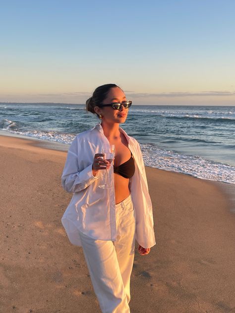 Girl holding wine glass at the beach at sunset. Wearing a black and white outfit. Golden hour, glowing skin. Bathing Suit Outfits Cover Up, White Cover Up Outfit, White Linen Outfit, Vietnam Clothes, White Beach Cover Up, Australian Winter, Beach Wearing, Bathing Suit Outfits, Sunset At The Beach