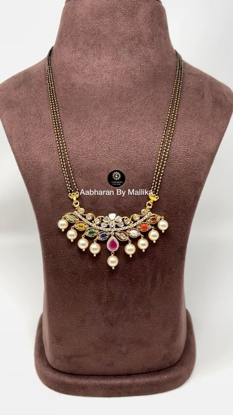 aabharanbymallika on Instagram: Presenting black beads chain with navratan pendant studded with diamonds and polkis ! For price and full product details pls send dm to… Navratan Pendant, Navratna Necklace, Navratan Necklace, Thali Chains, Pearl Necklace Tutorial, Black Beads Chain, Ruby Necklace Designs, Mangalsutra Chain, Simple Jewellery