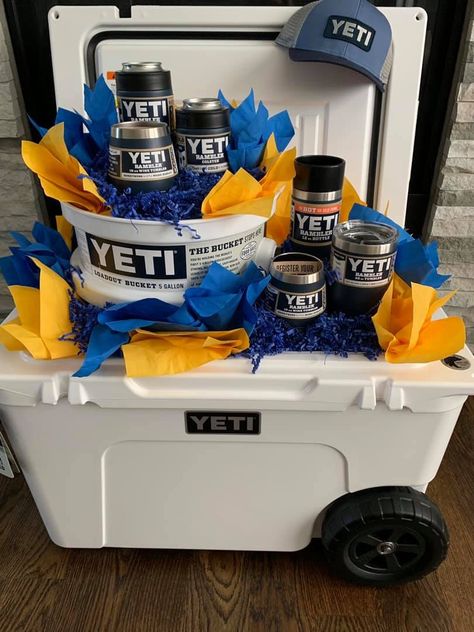 #yeti #rafflebasketideas #raffle #colster #tumbler #loadout #haulroller #tundrahaulroller #yetihat #fundraising #fundraiserideas #fundraiser #rambler #ramblerbottle #yetiwinetumbler #cooler #coolerpackage #scholarships Cooler Raffle Basket Ideas, Yeti Gift Basket, Cooler Gift Basket Ideas, Cooler Gift Basket, Raffle Gift Basket Ideas, Cheap Baby Shower Gifts, Silent Auction Basket, Auction Gift Basket Ideas, Baseball Fundraiser