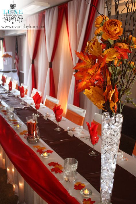 Orange, White, Brown and Red Wedding Decor in London Ontario | Olsen Wedding, Fall Wedding Leaves, Sept Wedding, September Wedding Colors, Wedding Decisions, Gala Decorations, Red Wedding Decorations, Tall Wedding Centerpieces, Head Table Wedding