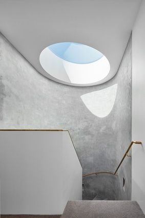 A dramatic circular skylight throws light onto the concrete wall of the spiral staircase. Image: Peter Clarke Architecture Art Nouveau, Borrowed Light, Sky Lights, Tree Cottage, Bay Tree, Round Window, Sky Light, Melbourne House, Perfect House