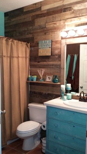 Our hall bathroom re-done. Reclaimed wood walls. Thrift store dresser, that was repainted, destressed and sanded. Thrift store solid surface counter top and bowl. Other walls  are brown and turquoise.  Absolutely love it. Final touch is Mason jar lights. Bathroom Ideas Brown, Reclaimed Wood Walls, Apartment Bathroom Ideas, Turquoise Bathroom, Mason Jar Lights, Brown Bathroom Decor, Wood Wall Bathroom, Brown And Turquoise, Trendy Apartment