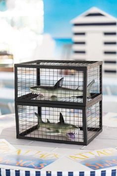 Caged Shark Table Centerpiece from a Shark Attack Birthday Party on Kara's Party Ideas | KarasPartyIdeas.com (20) Shark Table Centerpiece, Shark Fin Headband, Shark Themed Snacks, Baby Shark Party Ideas, Shark Party Ideas, Jaws Party, Shark Balloon, Shark Cupcakes, Baby Shark Party