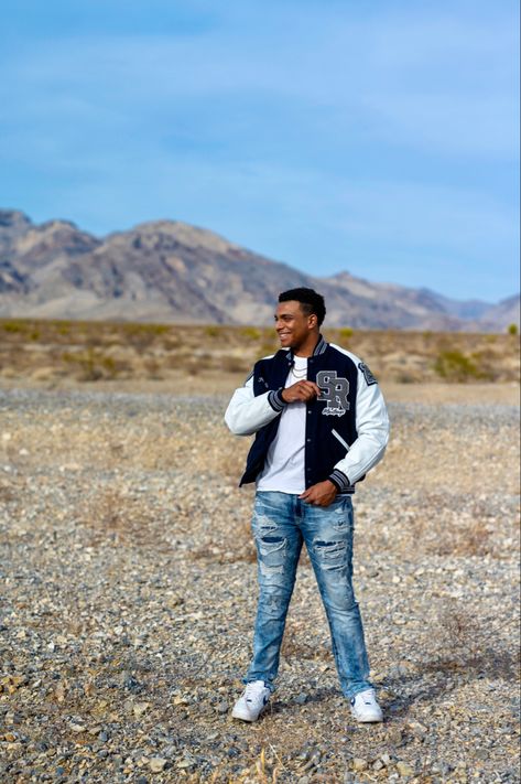 Boy photoshoot in the desert Senior Boy Outfit Ideas, Senior Year Portraits, Lettermans Jacket, Boy Senior Portraits, Senior Jackets, Senior Photos Boys, Senior Boy Poses, Senior Portrait Poses, Senior Pictures Boys