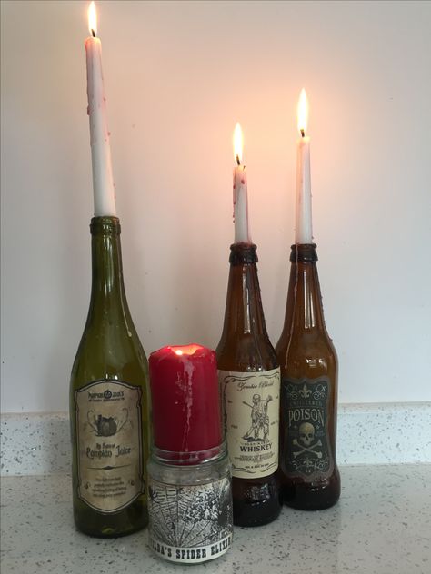 Glass Bottles Candle Holders, Candles In Wine Bottles Aesthetic, Glass Bottle Room Decor Aesthetic, Winebottle Candleholder Aesthetic, Glass Bottle Candle Holder, Liquor Bottle Candles, Future Interior Design, Wine Candles, Easy Diy Halloween Decorations