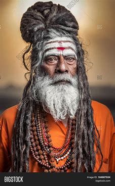 In Sanskrit, Jaṭā are rope-like strands of hair formed by locking or braiding hair written about 2,500 years ago. The dreadlocks are a matter of pride and provide deep spiritual connection, as a symbol of their closeness to God. The longer the locks, the longer duration of devotion they symbolize. The practice of Jaṭā (dreadlocks) is practiced in modern day Hinduism, most notably by Sadhus who follow Śiva. Shiva is often depicted with dreadlocks. Sadhu Baba, Aghori Baba, Braiding Hair, Ways Of Seeing, Spiritual Connection, Hair Strand, Varanasi, People Of The World, Sanskrit