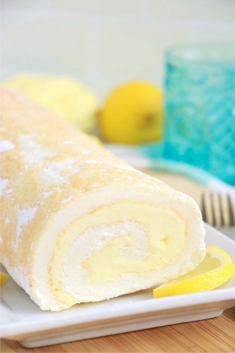 Easy Lemon Cake Roll - A light and fluffy angel food cake roll with decadent and creamy lemon filling. The perfect summertime dessert! Lemon Roll Cake Recipe, Lemon Roll Cake, Angel Food Cake Roll, Lemon Cake Roll, Lemon Roll, Easy Lemon Cake, Lemon Cake Easy, Lemon Pie Filling, Cake Rolls