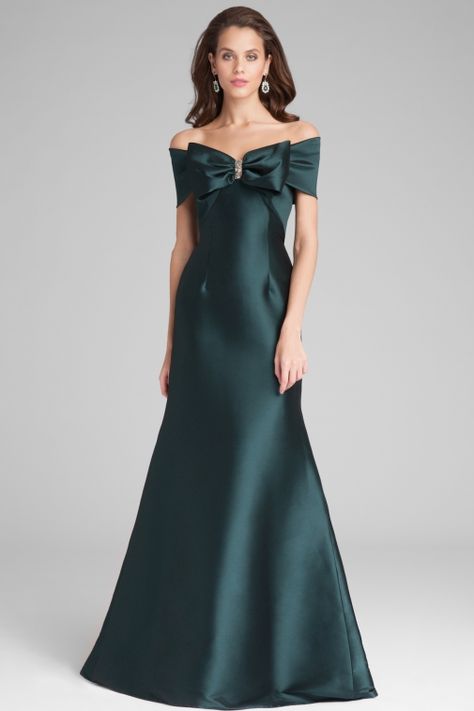 Simple yet stunning this forest green stretch mikado gown is perfect for galas and formal events. The off the shoulder neckline and statement bow with stone add to the allure of the gown. Mother Of The Bride Earrings, Mom Dresses, Mothers Gowns, Green Evening Gowns, Mob Dress, Gala Gowns, Mother Dresses, Satin Evening Gown, Mother Of The Bride Dresses Long