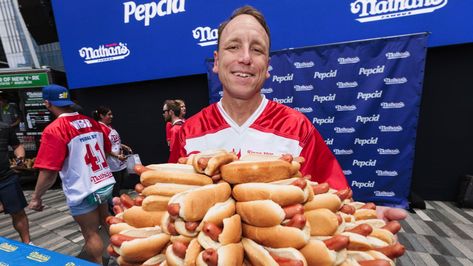 Joey “Jaws” Chestnut ate 62 franks and buns in 10 minutes to make another win at Nathan‘s Famous Fourth of July Hot Dog Eating Contest after a rain delay. Chestnut out-ate runner-up Geoffrey Esper and the rest of the 15 competitive eaters by double digits to clinch his eighth straight... Joey Chestnut, Dog Contest, Asparagus Fries, Chicken Fingers, Food Challenge, Amazing Race, Big Mac, Professional Chef, Coney Island