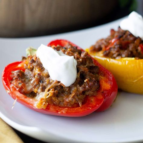 These keto, or low-carb, stuffed bell peppers feature a cauliflower rice, ground beef, and cheesy filling that everyone will enjoy. Stuffed Bell Peppers Keto, Keto Stuffed Bell Peppers, Green Bell Pepper Recipes, Keto Cabbage Recipe, Best Stuffed Pepper Recipe, Keto Green, Pepper Recipes, Soup With Ground Beef, Frozen Cauliflower Rice