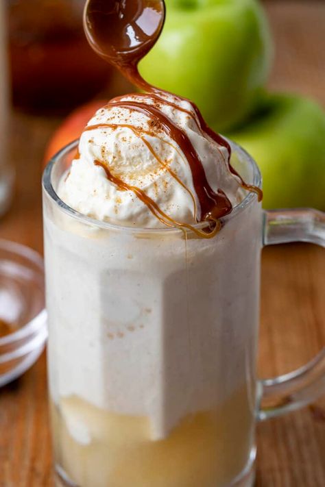 Caramel Apple Moonshine Float is an ice cream float for adults, made with apple cider moonshine, green apple pucker, Sprite and topped with cinnamon and caramel. Drinks, Cocktail, Moonshine, Ice Cream Float, Moonshine Float, Apple Pie Drink, Fall Drinks, iambaker, i am baker Drunken Snowman, Apple Cider Moonshine, Boozy Cookies, Snowman Cocktail, Apple Moonshine, Apple Pie Drink, Hot Chocolate Ice Cream, Sour Apple Pucker, Lime Mojito