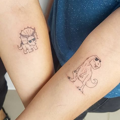 Frog Tattoo Ideas Matching, Fatherhood Symbol Tattoo, Simple Friends Tattoo, Friend Dinosaur Tattoos, Dinosaur Friend Tattoo, Dino Best Friend Tattoo, Funny Halloween Tattoos, Feminine Dinosaur Tattoo, Tattoo Ideas Dinosaur