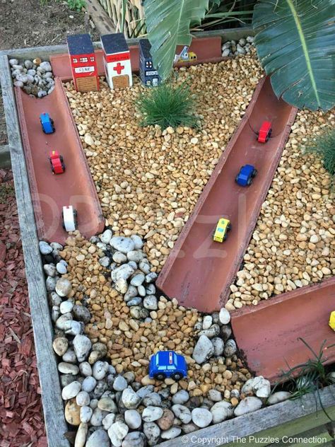 Outside Car Play Area, Outdoor Small World Play, Outdoor Truck Play Area For Kids, Outdoor Car Track For Kids, Outdoor Small World, Eyfs Outdoor Area, Backyard Play Spaces, Kid Friendly Backyard, Kids Yard