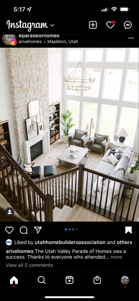 Wall Between Windows Living Room, Houses With Tall Windows, Fireplace Double Height, 2 Story Fireplace Decor, Fireplace Tall Ceilings Living Room, Big Living Room Windows, Tall Stone Fireplace Wall High Ceilings, Tall Ceiling Fireplace Ideas, House With Tall Ceilings