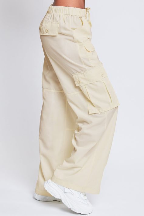 Every day is a new chance to wear our Women’s Relaxed Fit Cargo Pants. This high-waisted nylon pant features a relaxed fit for both style and comfort, ensuring you’ll look good and feel good throughout the day. Includes classic front pockets, three cargo pockets with button closures, and faux back pockets for maintaining a smoothing effect on your bum. These trendy pants are detailed with metal d-rings on the front belt loops and a drawstring waist so you can adjust the fit to your liking. Style