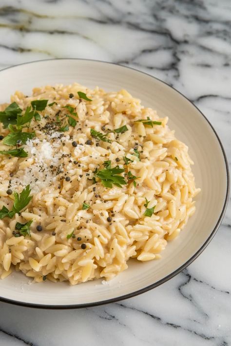 A photo of a  Parmesan Orzo Risotto a Orzo Recipes Low Sodium Orzo Recipes, Orzo With Vegetables, Chickpea Orzo Recipes, Ground Turkey Orzo Recipes, Easy Orzo Recipes, Simple Orzo, Creamy Orzo Recipes, Orzo Recipes Side, Orzo Dinner Recipes