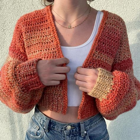 A chunky, hand-crocheted cardigan. Made with ombre orange, beige, and red acrylic yarn. Model is a size S/M, but will comfortably fit a small. Crochet Red Cardigan, Crochet Patchwork Sweater Red, Crochet Chunky Cardigan, Orange Cardigan Outfit, Red Crochet Long Sleeve Cardigan, Casual Red Crochet Cardigan, Chunky Yarn Projects, Red Crochet Long Sleeve Outerwear, Oversized Red Chunky Knit Cardigan