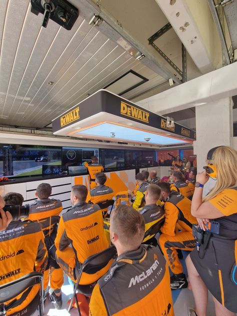 Mclaren Garage F1, Female F1 Driver Aesthetic Mclaren, F1 Pr Manager Aesthetic, Working In F1 Aesthetic, Mclaren Headquarters, Mclaren Garage, F1 Garage, F1 Aesthetic, Career Vision Board