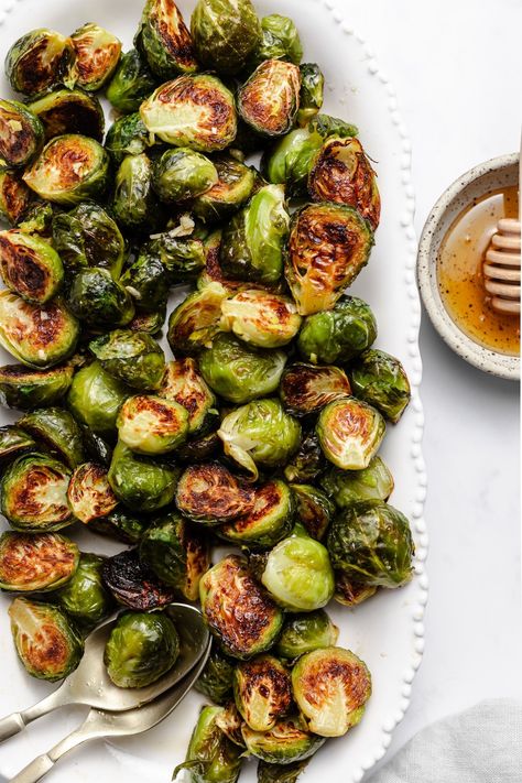 Hot Honey Glazed Brussels Sprouts Recipe Hot Honey Brussel Sprouts Air Fryer, Honey Butter Brussel Sprouts, Hot Honey Brussel Sprout Recipes, Brussel Sprout Recipes Honey, Sweet Brussel Sprout Recipes, Honey Garlic Brussel Sprouts, Hot Honey Brussel Sprouts, Shredded Brussel Sprout Recipes, Honey Glazed Brussel Sprouts