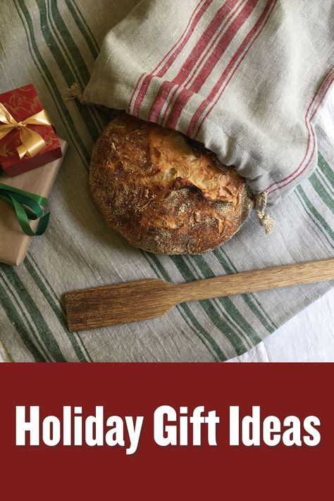 Red striped linen bag holding loaf of bread, laying on top of a green striped linen tea towel. Linen Bread Bag, Striped Kitchen, Bread Bag, Hosting Holidays, Bread Bags, Cloth Napkin, Tea Towel Set, Pittsburgh Pa, Kitchen Linens