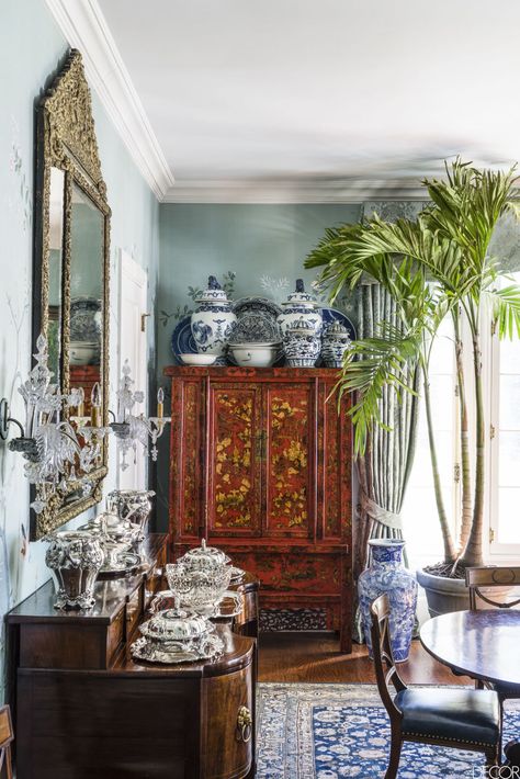 A cabinet is topped with ginger jars, platters, and bowls from Robert Duffy's extensive collection of 18th- to 20th-century blue-and-white ceramics; the curtains are of a Scalamandré damask. British Colonial Bedroom, Decorating Above Cabinets, Colonial Bedroom, Blue And White Decor, British Colonial Decor, Above Cabinets, Bedroom Minimalist, British Colonial Style, Blue White Decor