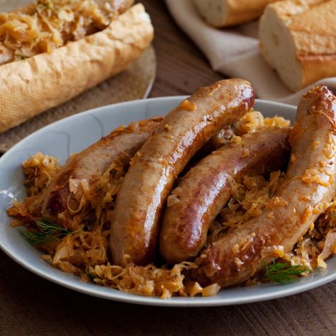 Bratwurst Stewed with Sauerkraut By Michael Symon Knockwurst Recipes, Sausage Sauerkraut, Bratwurst Recipes, Roast Chicken And Gravy, German Sausage, Michael Symon, Sauerkraut Recipes, Smoked Sausage, Cooking Show