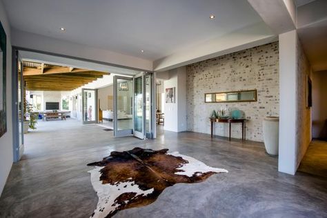 The Pros and Cons of Concrete Flooring | HGTV Cement Floors In House, Concrete Living Room Floors, Cleaning Concrete Floors, Finished Concrete Floors, Concrete Floors Living Room, Seal Concrete Floor, Concrete Floors In House, Heated Concrete Floor, Acid Stained Concrete Floors