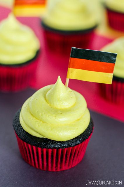 Germany Cupcakes - Black, red and yellow themed cupcakes perfect for your next German themed party! | JavaCupcake.com German Themed Party, Germany Party, German Party, Oktoberfest Party, Strawberry Filling, Themed Cupcakes, Fun Cupcakes, German Food, Red And Yellow