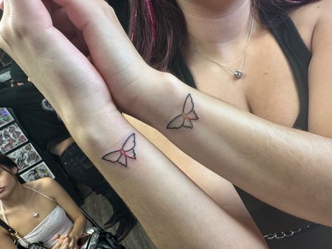 Pink and yellow cancer ribbon butterfly tattoo on wrists Butterfly Ribbon Tattoo, Ribbon Butterfly Tattoo, Ribbon And Butterfly Tattoo, Cancerian Butterfly Tattoo, Pink Ribbon With Butterfly Tattoos, Small Tattoo Ideas For Cancers, Simple Butterfly, Ribbon Tattoos, Line Tattoos