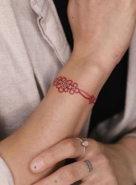 Girl Tattoos Archives - Get an InkGet an Ink Red Bracelet Tattoo, Red Wrist Tattoo, Red String Tattoo, Charm Tattoo, Wrap Around Tattoo, Cuff Tattoo, Flying Tattoo, Ring Finger Tattoos, Flower Wrist Tattoos