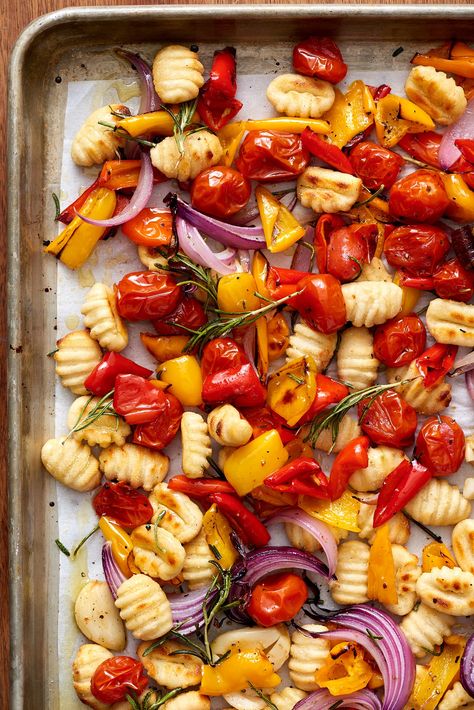 A one-pan dinner of roasted gnocchi and vegetables that doesn't even require you to boil the dumplings. Crispy Sheet Pan Gnocchi, Sheet Pan Gnocchi, Easy Sheet Pan Dinners, Easy Vegetarian Dinner, Sheet Pan Dinners Recipes, One Pan Dinner, Gnocchi Recipes, Vegetarian Dinners, Sheet Pan Dinners