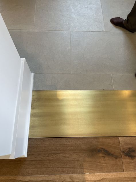 Gold Floor Tiles Bathroom, Wide Threshold Transition, Brass Floor Threshold, Doorway Floor Transition Ideas, Transition Pieces For Flooring, Brass Floor Transition, Kitchen Floor Transition To Wood, Marble Floor Transition, Lvp To Tile Transition