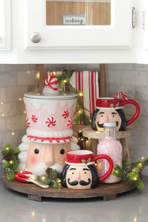 Join in this Christmas home tour with this nutcracker inspired Christmas kitchen decor.  Fun and festive ways to decorate your kitchen for the holidays! Christmas Decor Ideas For Living Room Nutcracker, Mixer Christmas Decor, Nutcracker Storage Ideas, Gingerbread Theme Kitchen Decor, Christmas Mug Decor, Nutcracker Kitchen Decor, Gingerbread Cookie Jar, Nutcracker Charcuterie Board, Kitchen Bar Christmas Decor