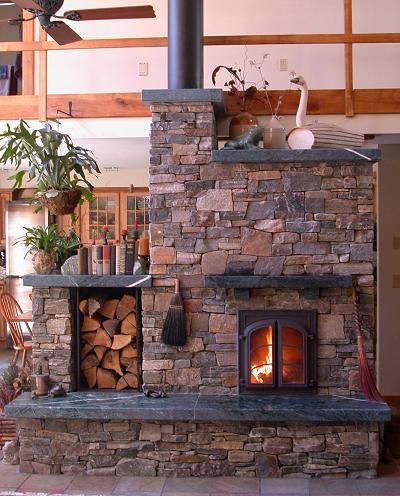 Masonry heater. Takes only a few sticks of wood and heats for a day or two. And never needs chimney sweep. Masonry Heaters, Masonry Heater, Rocket Stoves, Stove Fireplace, Home Fireplace, The Fireplace, Into The Woods, Wood Burning Stove, Stone Fireplace