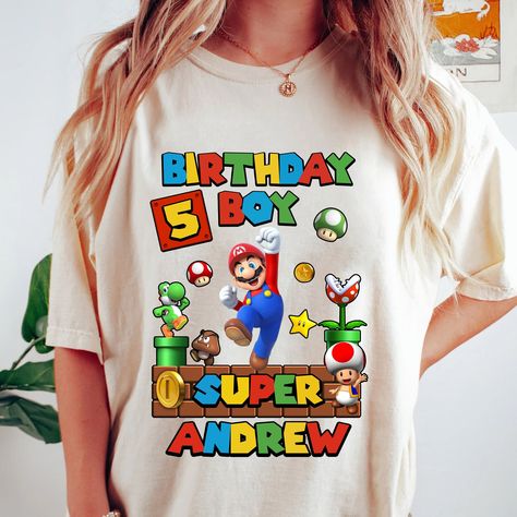 Super Mario Birthday Shirt, Super Mario Birthday Boy Shirt, Family Birthday Shirt, Kids Birthday Shirt, Custom Birthday Shirt - Unisex shirts run true to size. Please see our size chart for sizing details. Features: - 100% Quality Guarantee - Super Soft Cotton 4.3 oz, 100% combed cotton jersey - Heather Gray 90% cotton/10% polyester; Fabric laundered - 32 singles for extreme softness; 1x1 baby rib-knit set-in collar - Shipped from the USA Super Mario Birthday Shirt, Kids Birthday Shirt, Birthday Boy Shirt, Kids Birthday Shirts, Custom Birthday Shirts, Super Mario Birthday, Family Birthday Shirts, Long Sleeve Baseball Tee, Custom Tank Tops