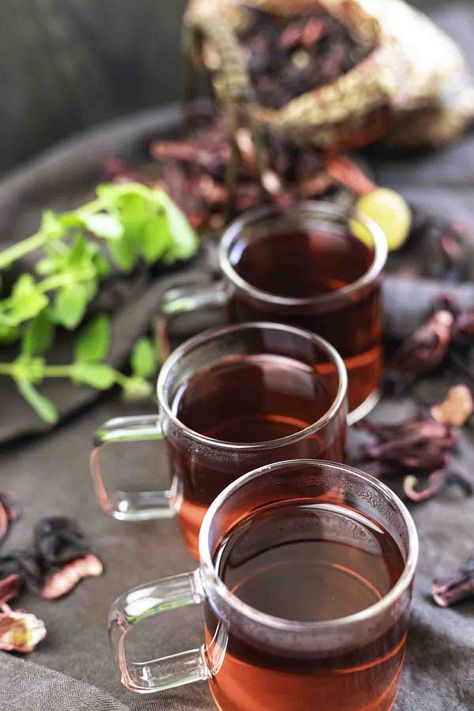 Learn How To Make Hibiscus Tea or Agua De Jamaica herbal tea made with dried hibiscus flowers. With this quick and easy recipe, you can enjoy your hibiscus tea hot or make a refreshingly sweet and tart iced tea. It is the perfect alternative to sugary drinks like soda. Dried Hibiscus Flower Recipes, Hibiscus Recipes, Hibiscus Recipe, Hot Tea Recipes, Dried Hibiscus Flowers, Ditch The Carbs, Keto Easy, Low Carb Drinks, Sugary Drinks