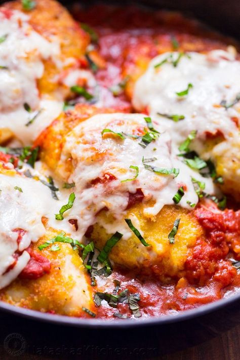 This Stuffed Chicken Parmesan is crisp on the outside and so juicy with a surprise inside. This is an easy, one-pan, 30 minute parmesan chicken dinner you'll make over and over! | natashaskitchen.com Best Chicken Parmigiana Recipe, Stuffed Chicken Parmesan, Chicken Parmigiana Recipe, Natashas Kitchen, Chicken Parmesan Recipe, Parmesan Recipe, Chicken Breast Recipes Baked, Easy Chicken Parmesan, Chicken Parmigiana