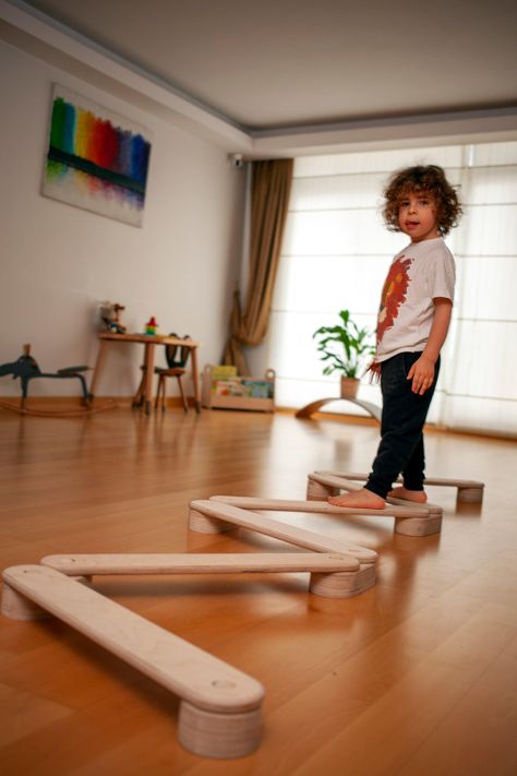 Tour of Montessori Classroom 🔆 #MontessoriBed #ChildFurniture #ToddlerRoomDecor #NaturalMaterials #WoodenToys #KidsRoomInspiration #MontessoriHome #EcoFriendlyKids #ToddlerSleep #ParentingIdeas Kids Balance Board, Montessori Board, Wooden Balance Board, Tactile Learning, Kids Motor Skills, Physical Training, Montessori Baby Toys, Montessori Furniture, Balance Beam