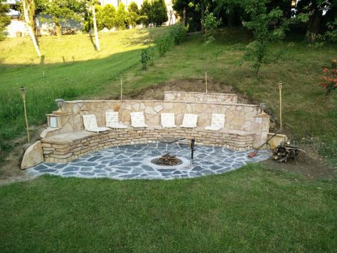 Adding a fire pit can create a stunning atmosphere in your backyard. Though there are many different methods to this madness, it it still possible to have a truly beautiful addition to make everyone jealous of your skills. Location or terrain can at times cause issues in design and installation. For example, slopes and hillsides can … Cheap Fire Pit, Outside Fire Pits, Fire Pit Materials, Sloped Yard, Fire Pit Ring, Build A Fireplace, Fire Pit Landscaping, Sloped Backyard, Sloped Garden