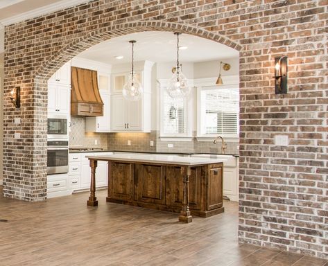 Bryan College Station Custom Homes — Magruder Homes Wide Oak Flooring, Archways In Homes, Brick Archway, Brick Accent Wall, Dreams To Reality, Brick Arch, Brick Kitchen, College Station, Their Story