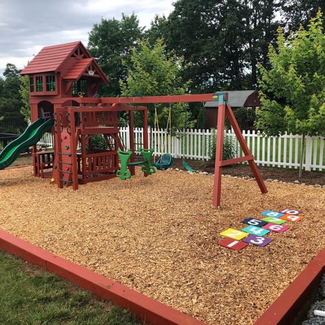 Backyard Playground Border, Backyard Layout With Playground, Landscaping Around Playground, Campground Playground Ideas, Playground Sandbox Ideas, Home Playground Landscaping, Fenced In Play Area For Kids Backyard, Playground Base Ideas, Play Scapes Backyard