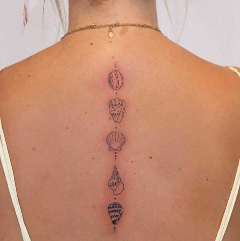 24 Sea-Inspired Tattoos: Waves, Shells, Whales, and Sharks • She Seas Sea Inspired Spine Tattoo, Ocean Style Tattoo, Back Tattoo Sea Theme, Back Tattoo Women Ocean, Sea Turtle Spine Tattoo, Sea Animal Spine Tattoo, Shells Tattoo Ideas, Spine Ocean Tattoo, Shark Tattoo Spine