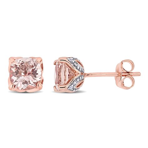 These stunning morganite and diamond stud earrings are crafted in lustrous 10-karat rose gold and feature cushion-cut, prong-set morganite gemstones along with a total of eight round-cut, pave-set glistening diamonds in a simple and sophisticated stud earring design. An elevated take on a classic style, these gemstone and diamond earrings are sure to make a standout addition to any ensemble. Small Earrings Gold, Diamond Pendants Designs, Rose Gold Earrings Studs, Rose Gold Morganite, Antique Jewelry Indian, Morganite Diamond, Rose Gold Studs, Anniversary Ideas, Solitaire Studs